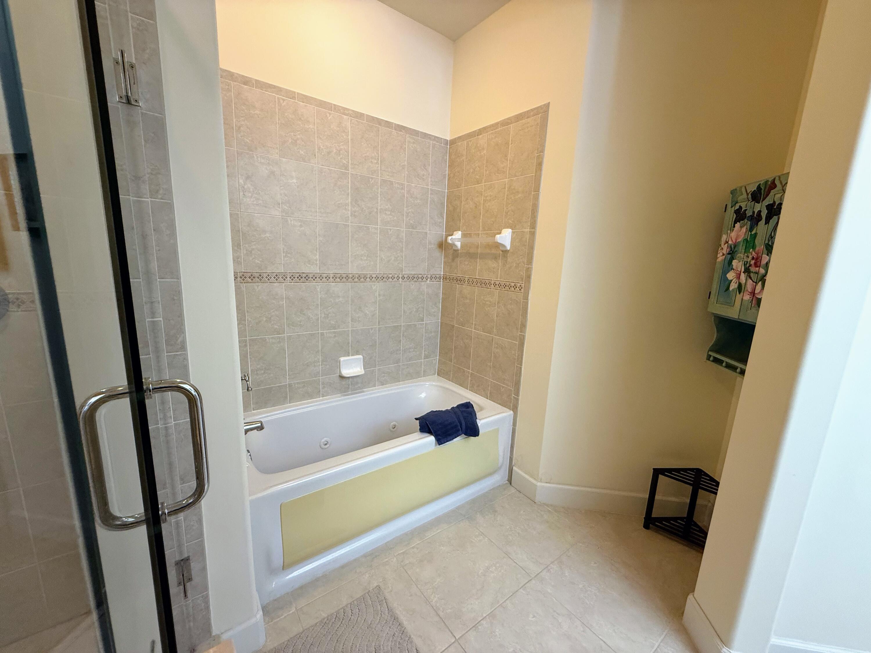 20 Orange Avenue, Unit 9 Fort Pierce, FL 34950 - Photo 79 of 92 a bathroom with a tub and shower