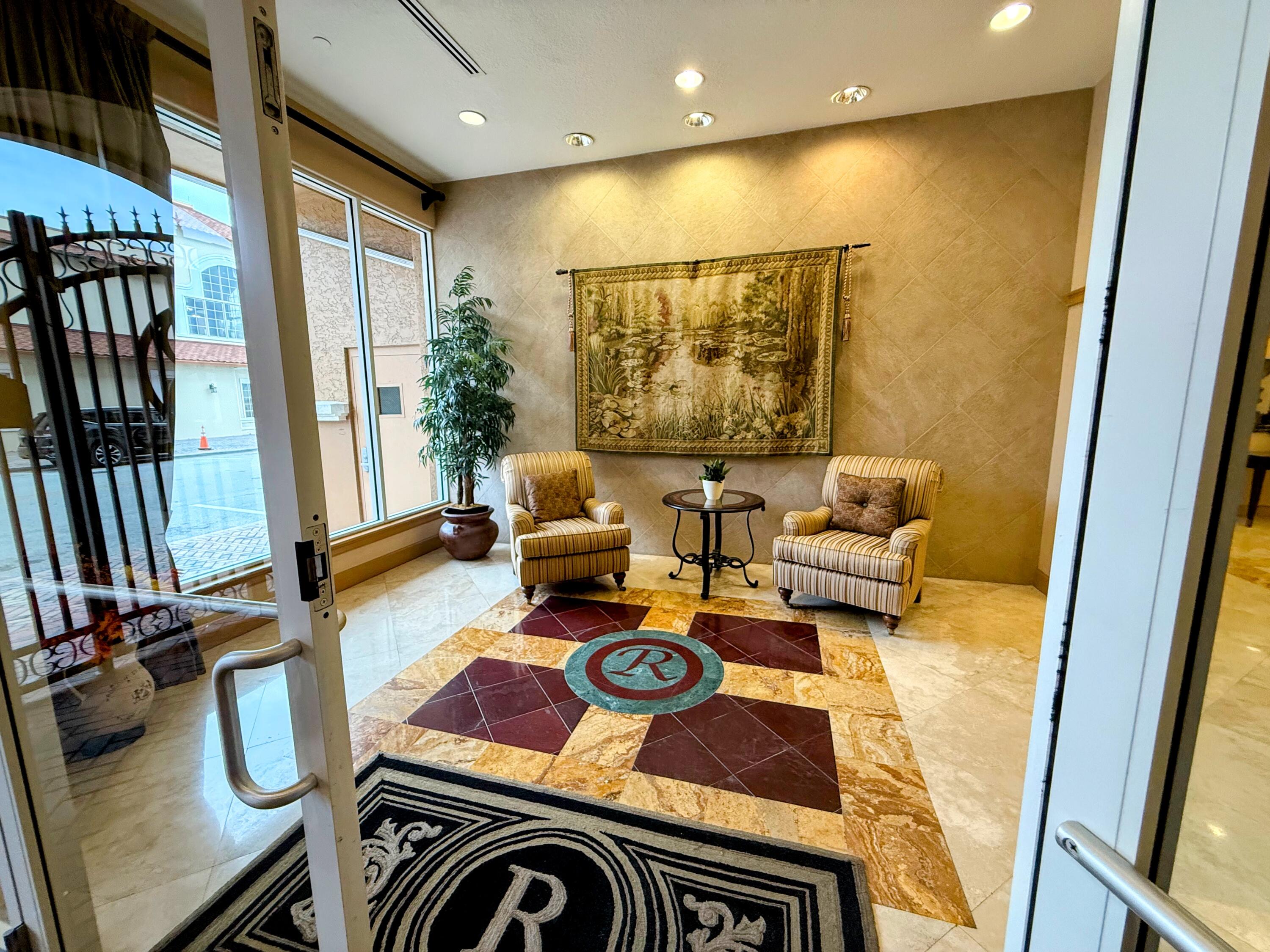 20 Orange Avenue, Unit 9 Fort Pierce, FL 34950 - Photo 9 of 92 a outdoor living space with furniture and a flat screen tv