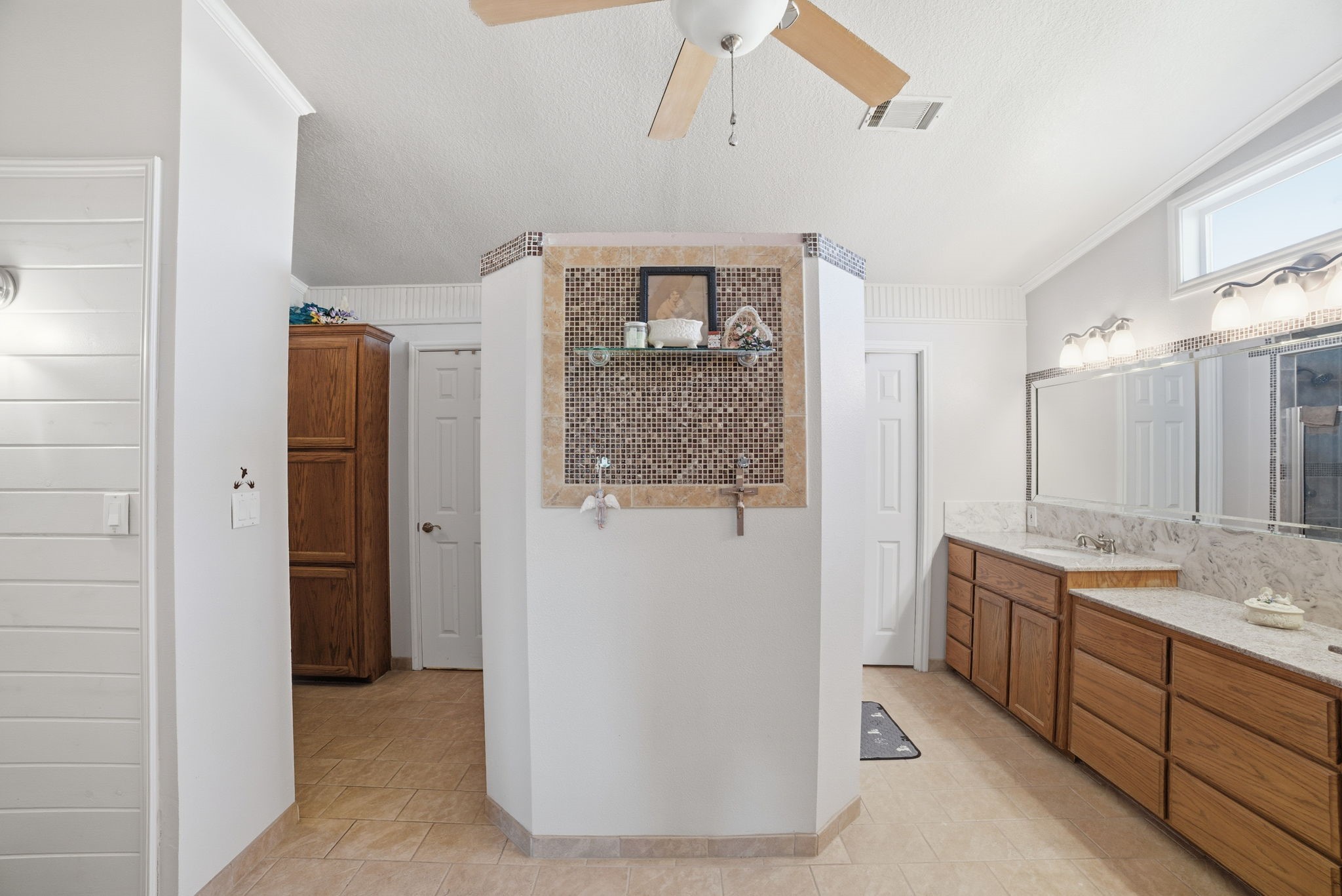 2124 Hackberry Road Salado, TX 76571 - Photo 16 of 27 a bathroom with a granite countertop sink a mirror and a shower