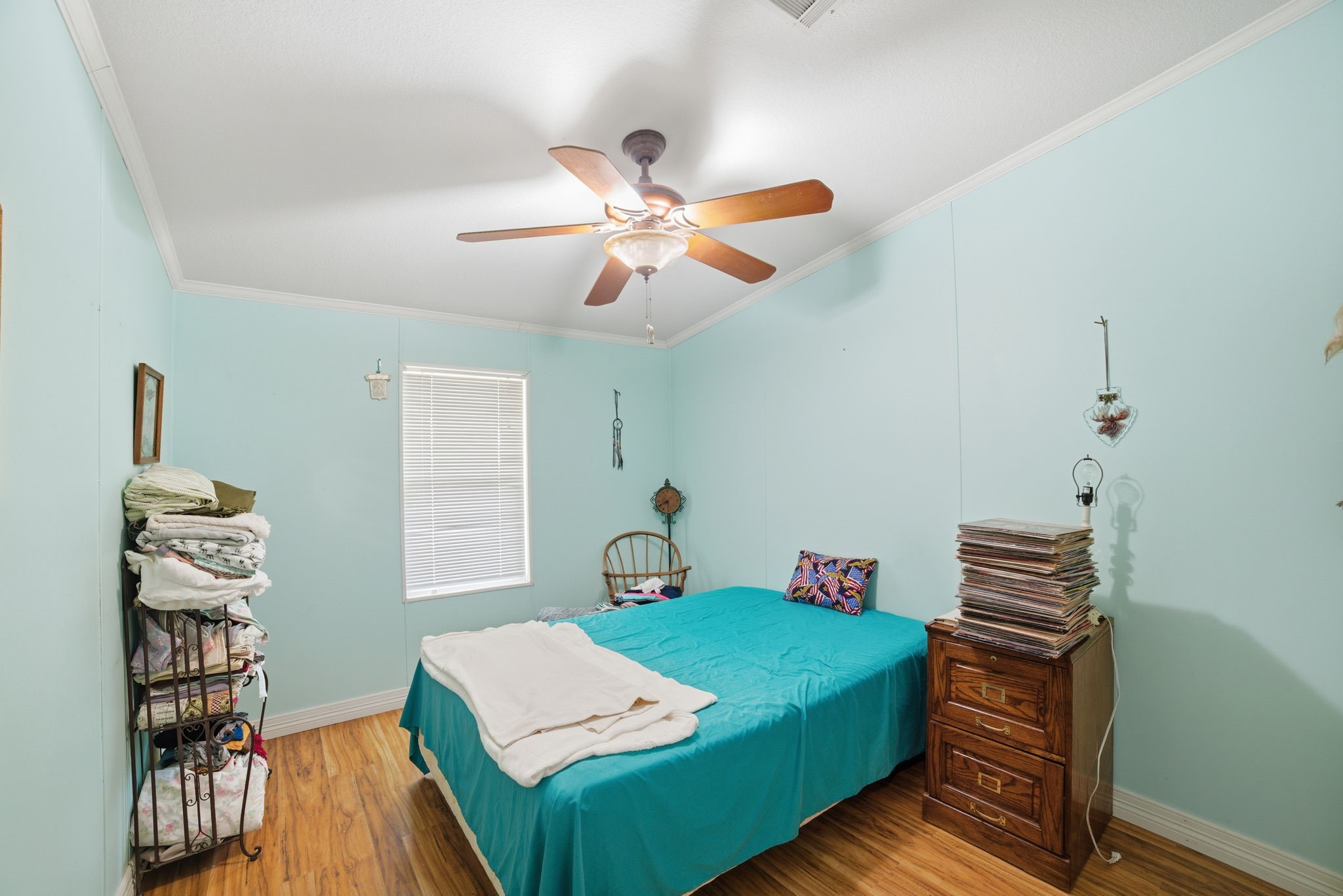 2124 Hackberry Road Salado, TX 76571 - Photo 22 of 27 a bedroom with a bed and wooden floor
