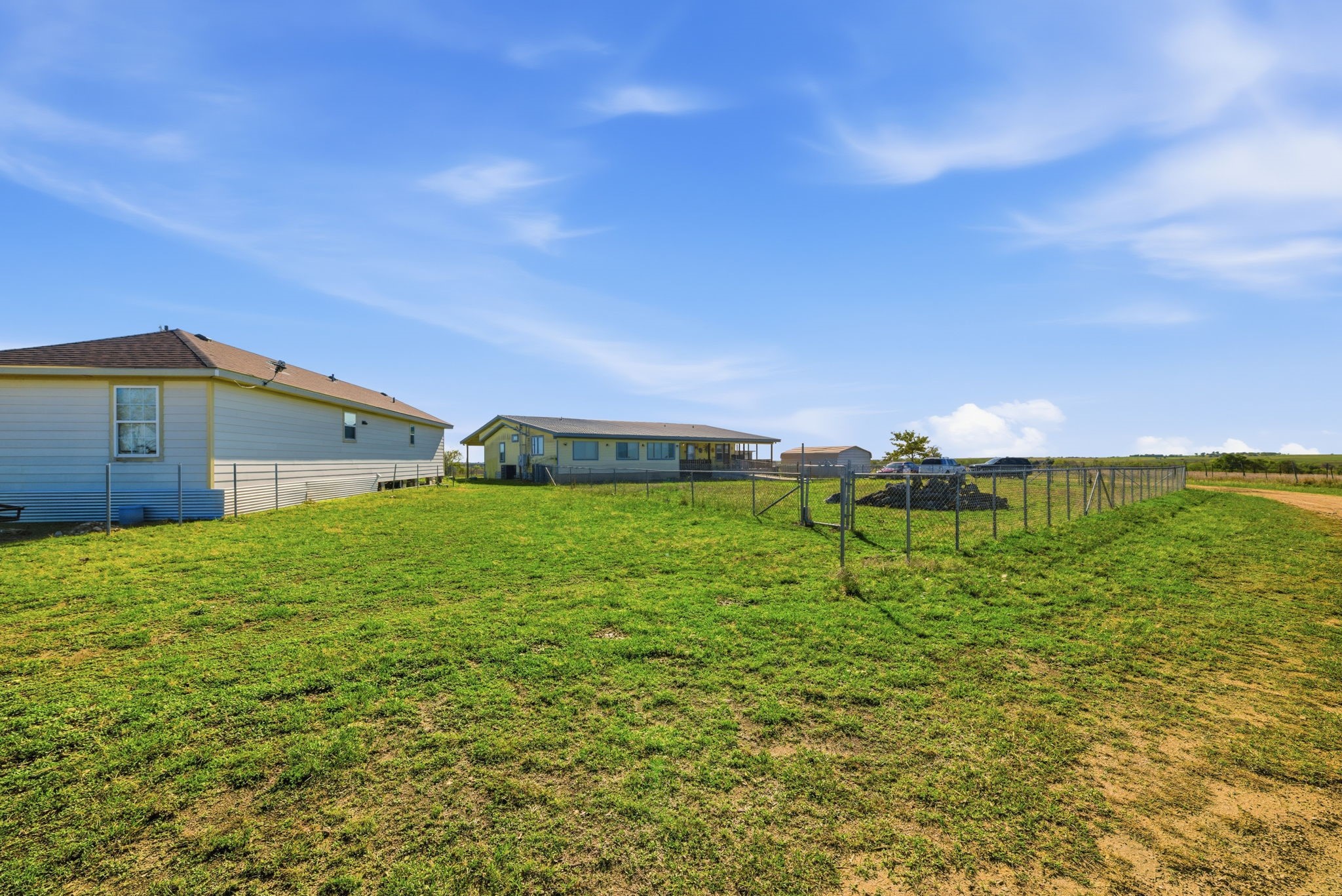 2124 Hackberry Road Salado, TX 76571 - Photo 27 of 27 a backyard of a house with table and chairs
