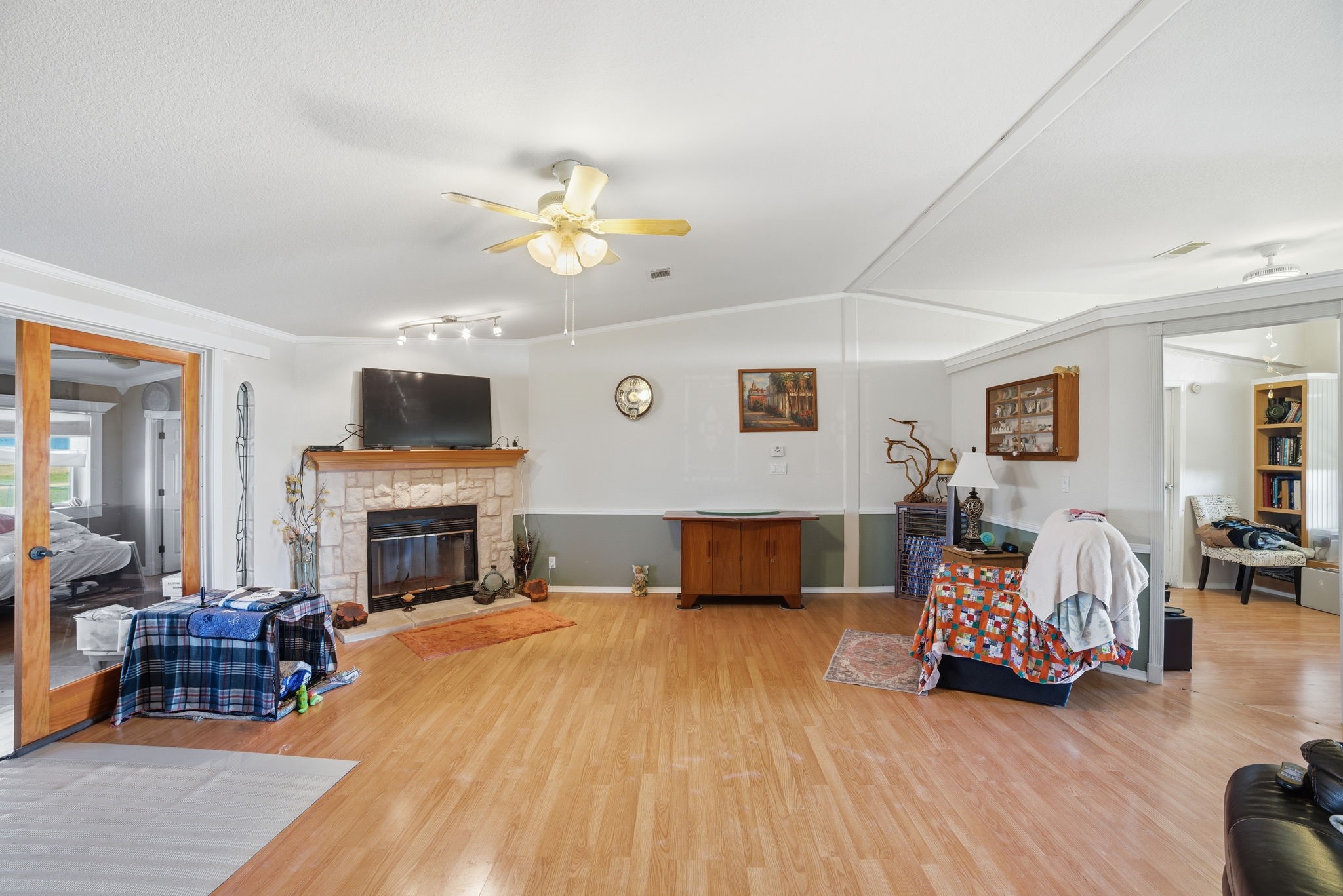 2124 Hackberry Road Salado, TX 76571 - Photo 8 of 27 a bedroom with furniture and a fireplace