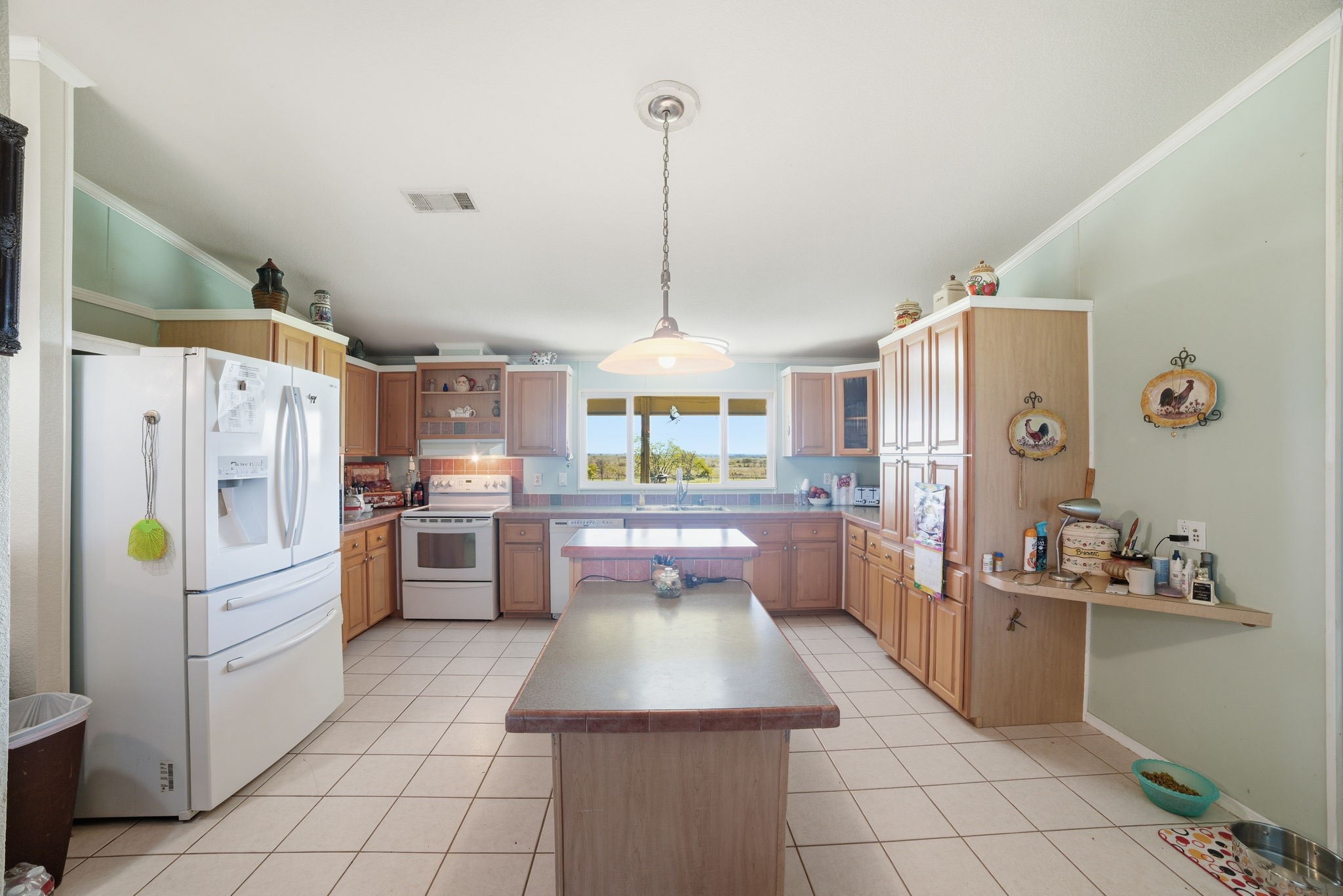 2124 Hackberry Road Salado, TX 76571 - Photo 9 of 27 a kitchen with refrigerator and cabinets
