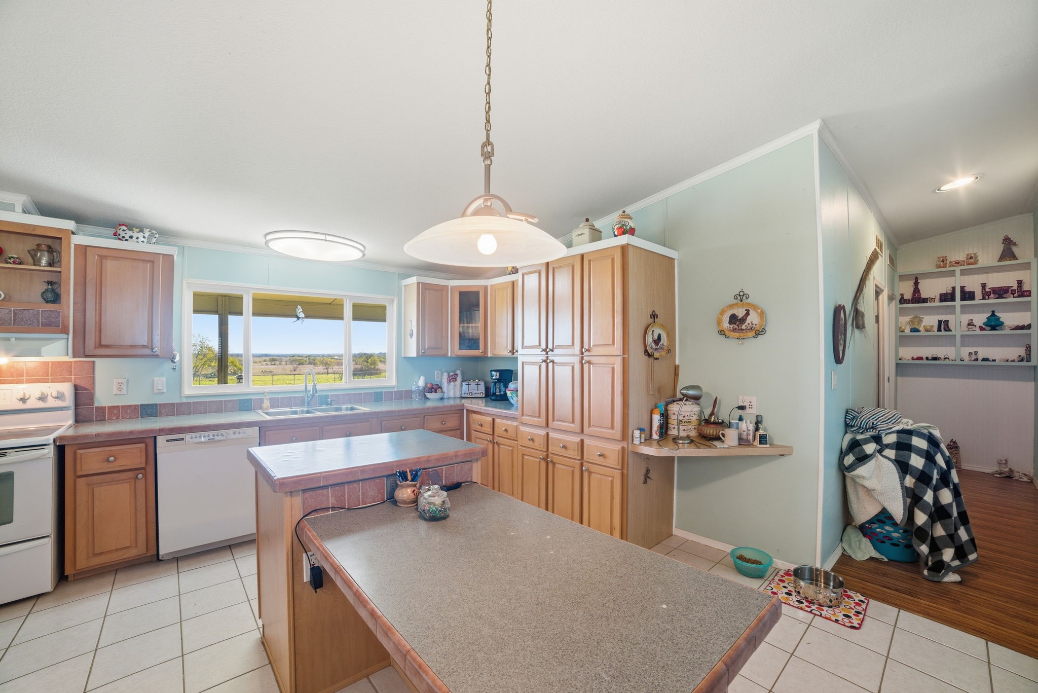 2124 Hackberry Road Salado, TX 76571 - Photo 10 of 27 a kitchen with stainless steel appliances a table and chairs in it