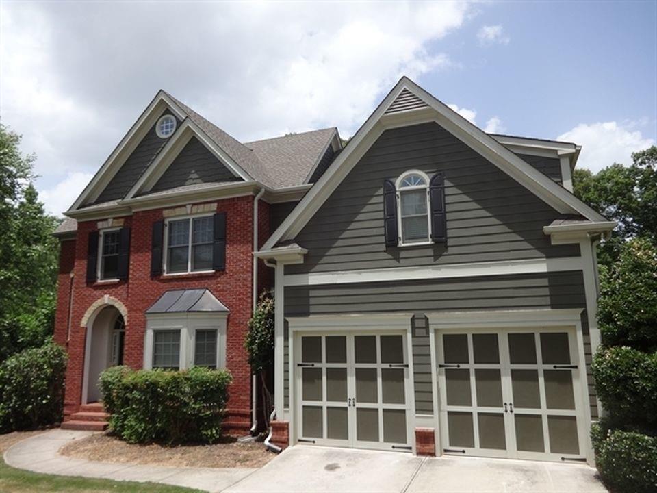 120 Stargaze Ridge Canton, GA 30114 - Photo 1 of 1 a front view of a house with a yard