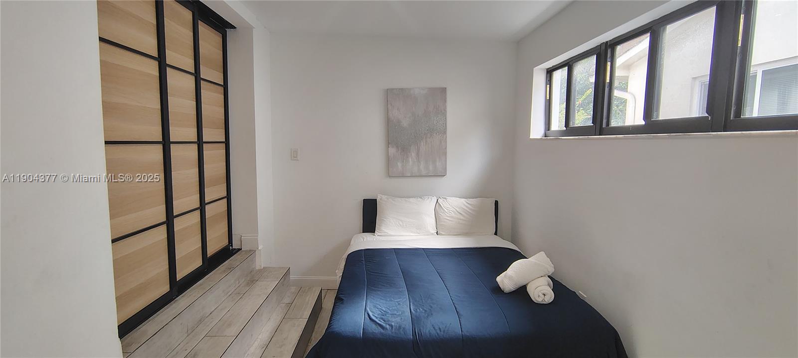 420 Northeast 90th Street El Portal, FL 33138 - Photo 8 of 18 a living room with furniture and wooden floor