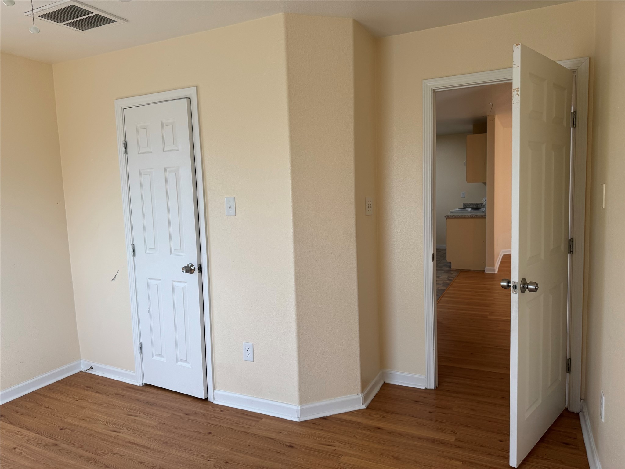 711 Hahlo Street Houston, TX 77020 - Photo 11 of 13 a view of a hallway with wooden floor