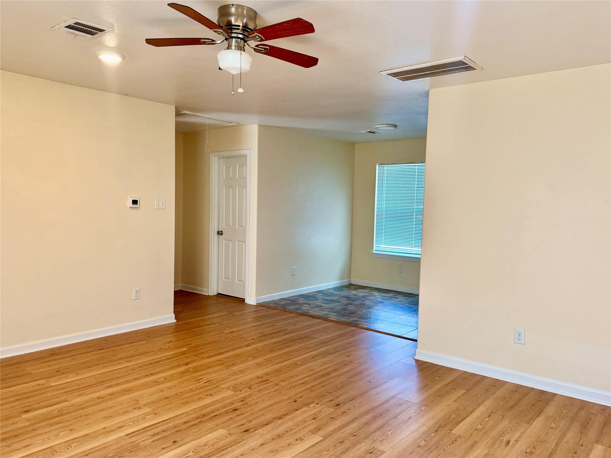 711 Hahlo Street Houston, TX 77020 - Photo 4 of 13 a view of an empty room with wooden floor