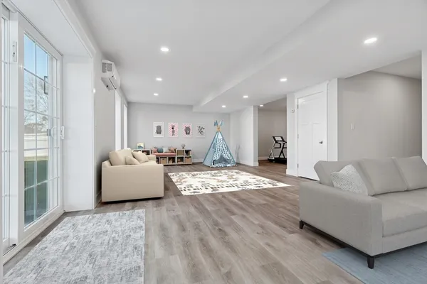 a living room with furniture and a large window