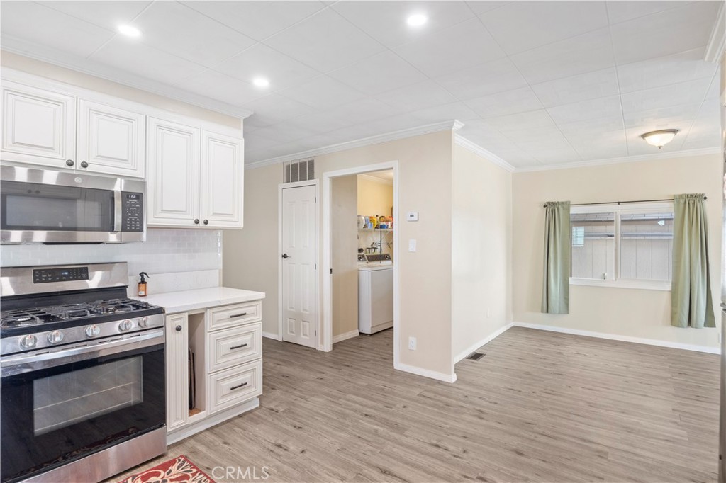 127 Brookside Lane Oceanside, CA 92056 - Photo 12 of 30 a kitchen with stainless steel appliances a stove and a microwave
