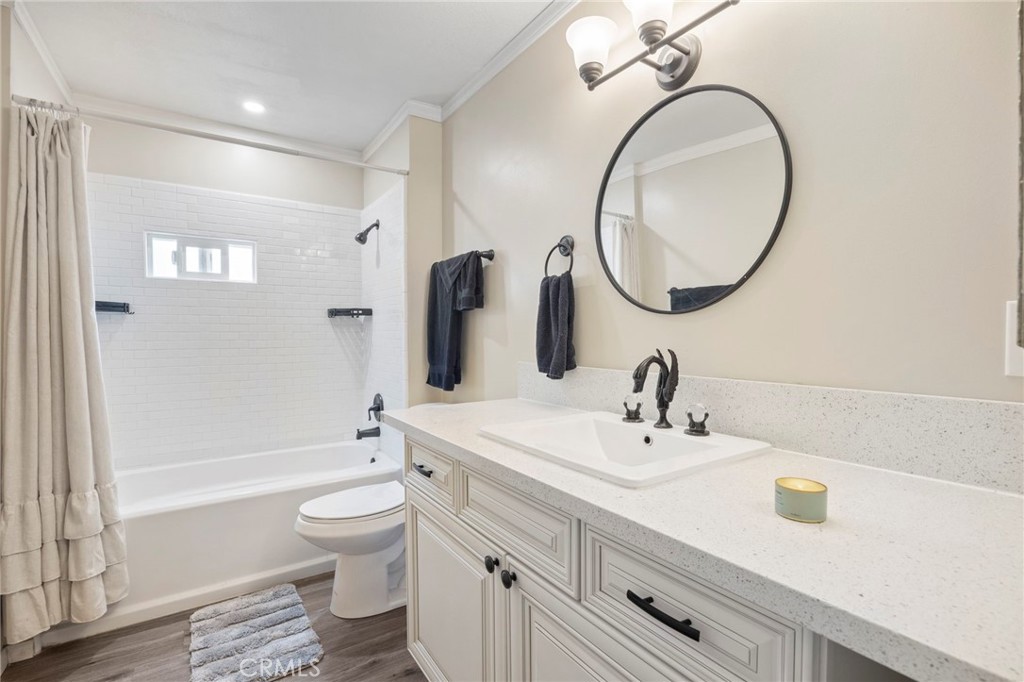 127 Brookside Lane Oceanside, CA 92056 - Photo 19 of 30 a bathroom with a sink a toilet and a mirror