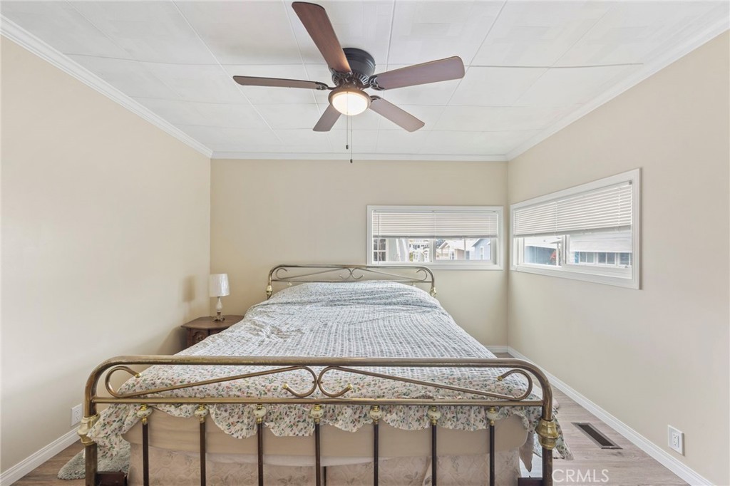 127 Brookside Lane Oceanside, CA 92056 - Photo 21 of 30 a bedroom with a bed and a ceiling fan
