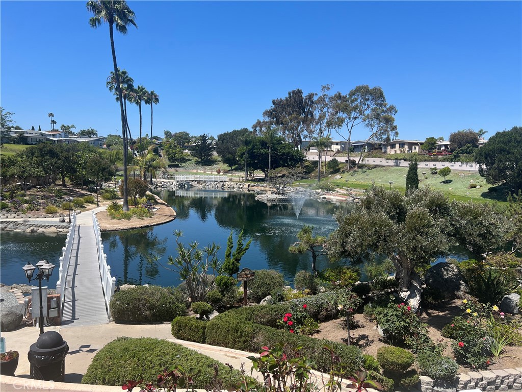 127 Brookside Lane Oceanside, CA 92056 - Photo 26 of 30 a view of a lake with a house in the background