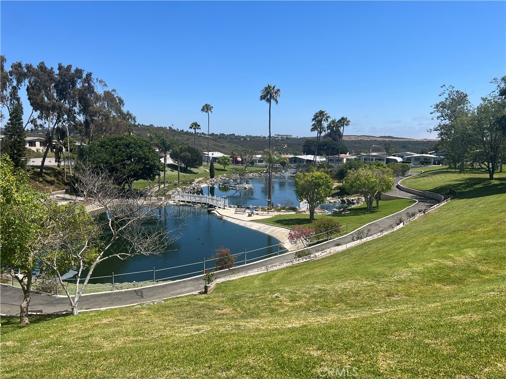 127 Brookside Lane Oceanside, CA 92056 - Photo 27 of 30 a view of a swimming pool with a yard