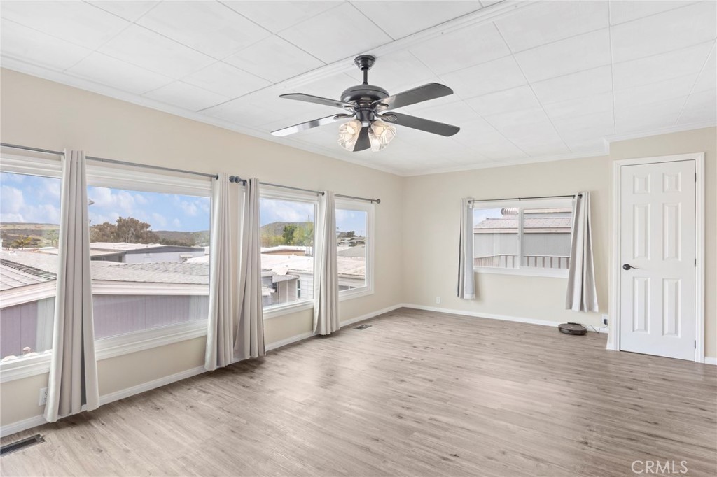 127 Brookside Lane Oceanside, CA 92056 - Photo 5 of 30 wooden floor in an empty room with a window