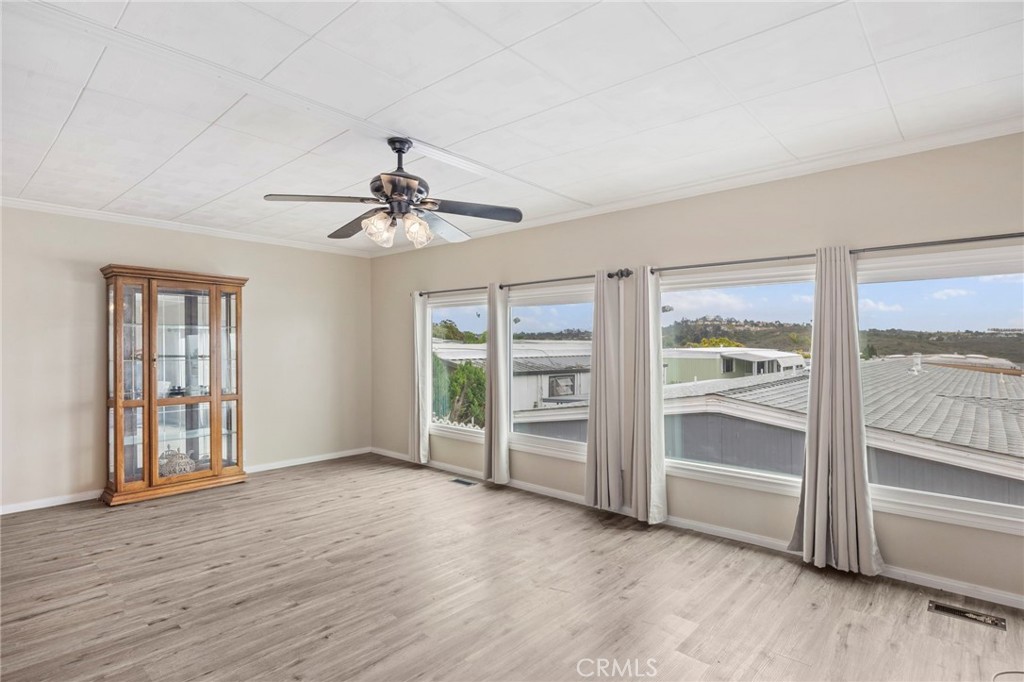 127 Brookside Lane Oceanside, CA 92056 - Photo 6 of 30 wooden floor in an empty room with a window