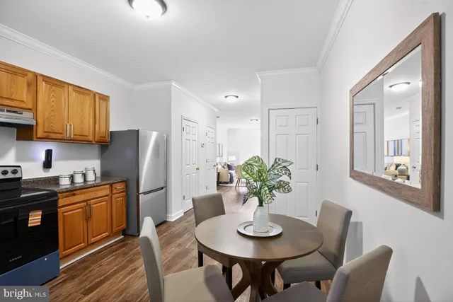 a view of a livingroom with furniture and wooden floor