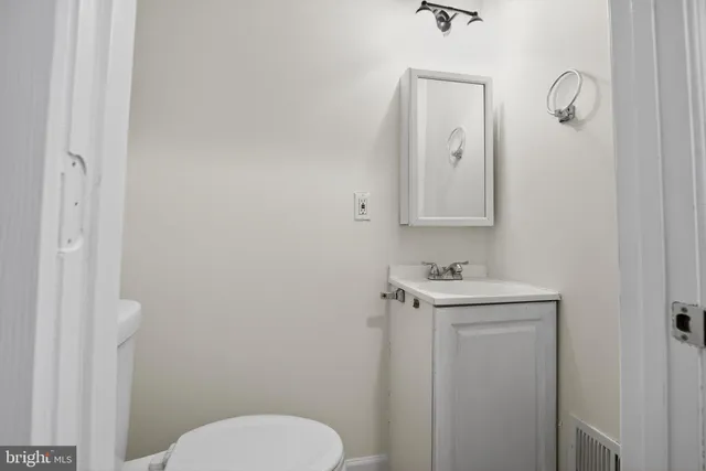 a bedroom with a bed and a table