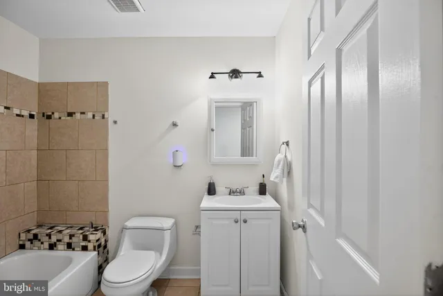 a bathroom with a bathtub and shower