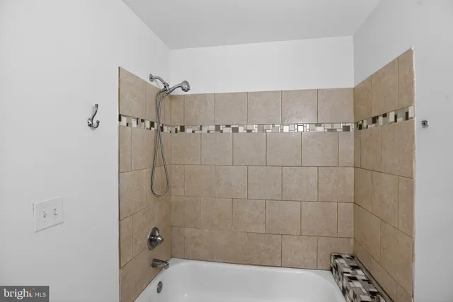 a view of a room with wooden floor and windows