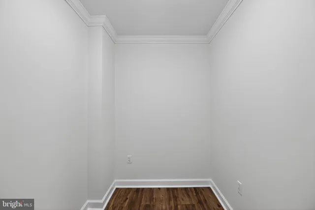 a view of empty room with wooden ceiling