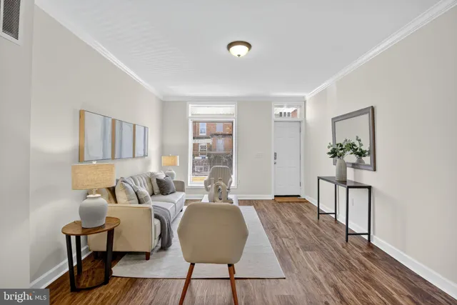 a view of dining room with furniture and wooden floor