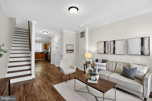 a view of kitchen with furniture and wooden floor