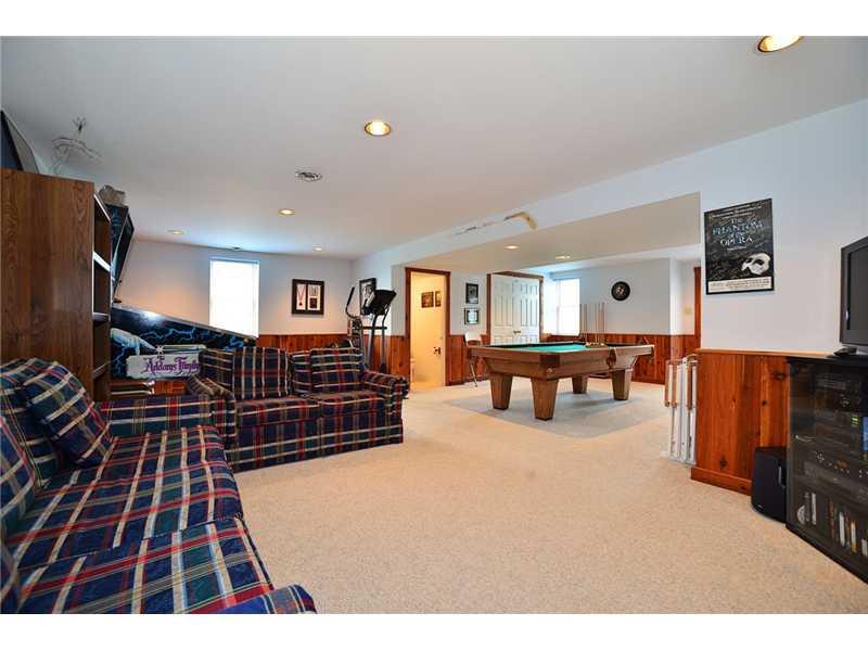 615 Miranda Road Upper St. Clair, PA 15241 - Photo 18 of 22 Basement/Game Room. Light & bright with wood paneling, powder room and walk-out entrance to rear yard. Pool table is included!