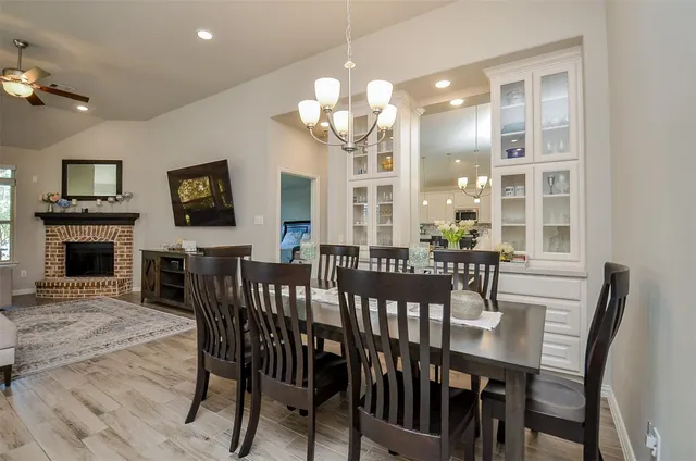 a kitchen with kitchen island a sink and a large window