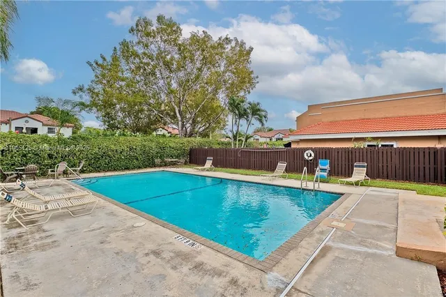 a view of a swimming pool with a patio