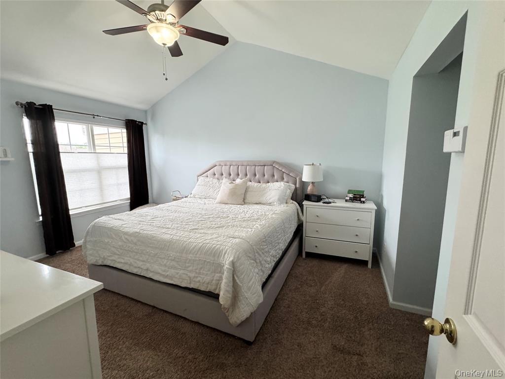 5 Case Court Monroe, NY 10950 - Photo 14 of 35 a bedroom with a bed and a chandelier