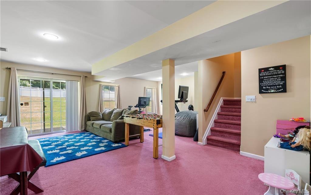 5 Case Court Monroe, NY 10950 - Photo 24 of 35 a bedroom with furniture and a wooden floor