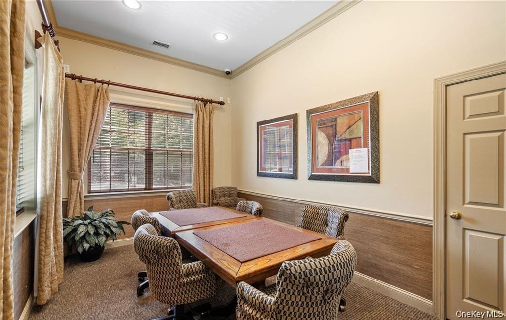 5 Case Court Monroe, NY 10950 - Photo 32 of 35 a bedroom with a bed and glass windows