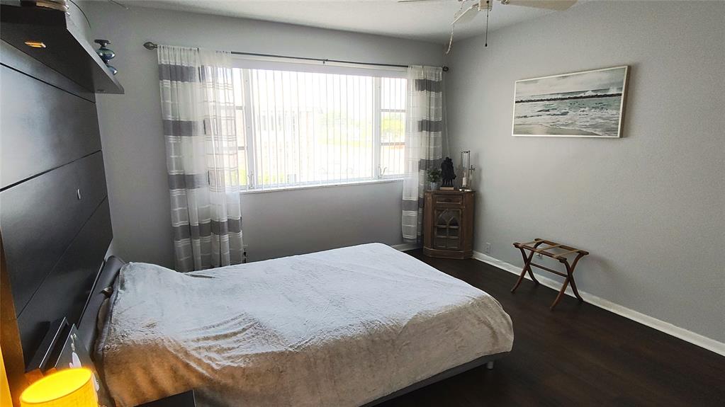 412 South Cypress Road, Unit 222 Pompano Beach, FL 33060 - Photo 11 of 19 a bedroom with a bed and a window