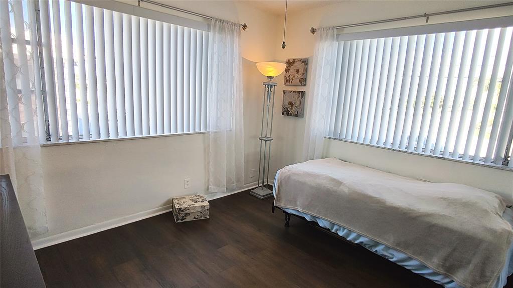 412 South Cypress Road, Unit 222 Pompano Beach, FL 33060 - Photo 12 of 19 a bedroom with a bed and a window