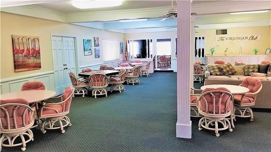 412 South Cypress Road, Unit 222 Pompano Beach, FL 33060 - Photo 15 of 19 a living room with furniture and wooden floor