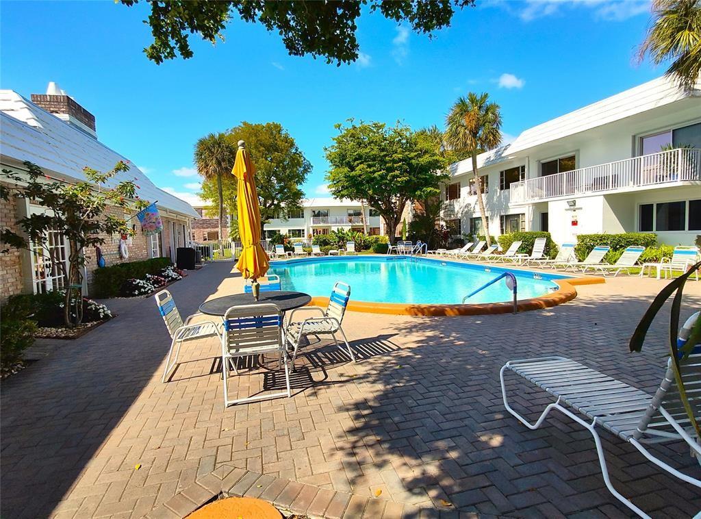 412 South Cypress Road, Unit 222 Pompano Beach, FL 33060 - Photo 17 of 19 an outdoor space with seating