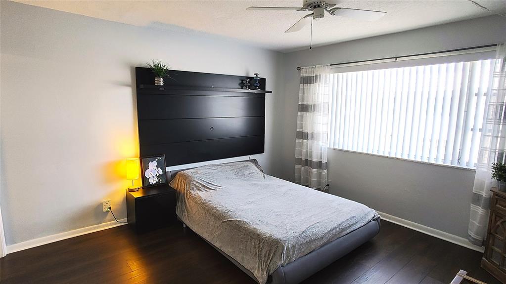 412 South Cypress Road, Unit 222 Pompano Beach, FL 33060 - Photo 10 of 19 a bedroom with a bed and a window