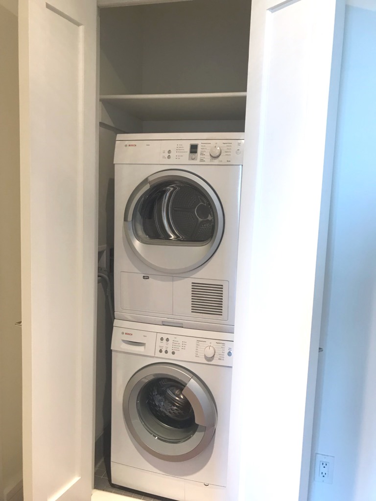 60 Riverside Boulevard, Unit 615 Manhattan, NY 10069 - Photo 14 of 15 a utility room with dryer and washer