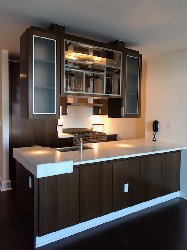 60 Riverside Boulevard, Unit 615 Manhattan, NY 10069 - Photo 5 of 15 a kitchen with a sink and cabinets