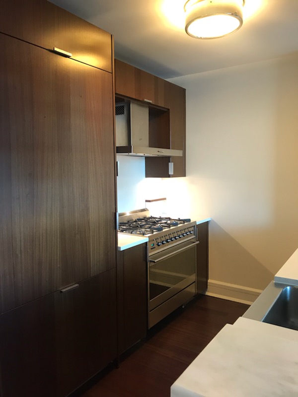 60 Riverside Boulevard, Unit 615 Manhattan, NY 10069 - Photo 7 of 15 a kitchen with a stove and a refrigerator