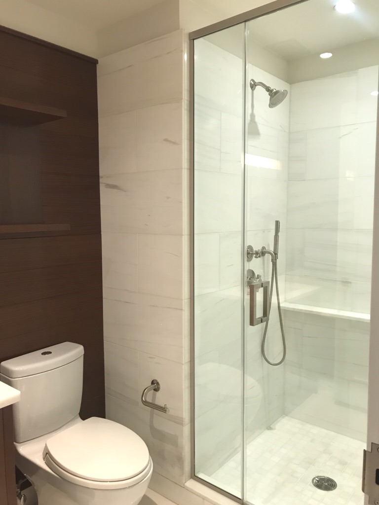 60 Riverside Boulevard, Unit 615 Manhattan, NY 10069 - Photo 9 of 15 a bathroom with a toilet and a shower