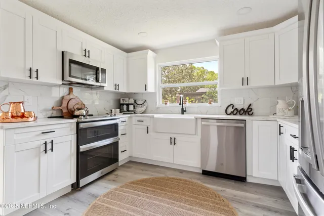 a bathroom with a sink a toilet and a bathtub