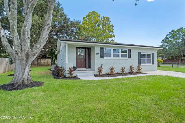 front view of a house with a yard