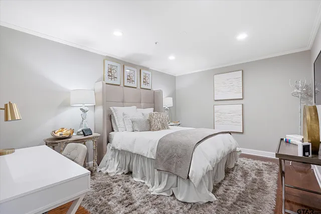 a bedroom with a bed and a couch