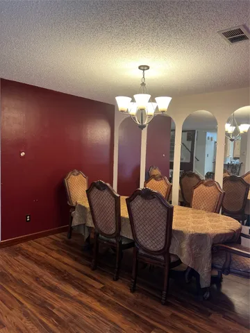 a view of a livingroom with furniture and a lamp