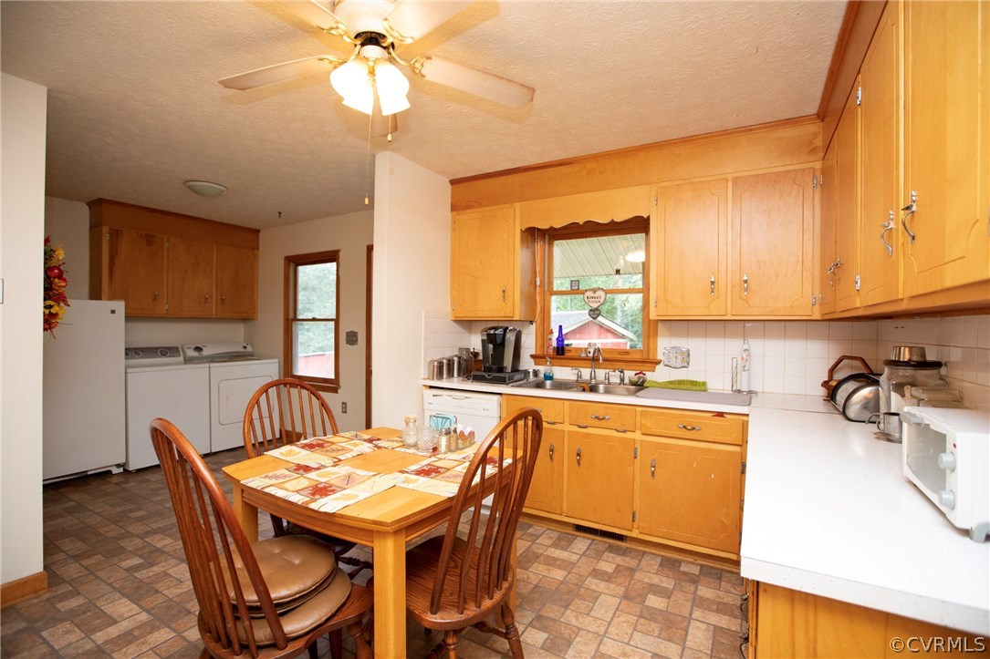 533 Schultz Ml Road Meherrin, VA 23954 - Photo 14 of 50 a kitchen with a dining table chairs and a refrigerator