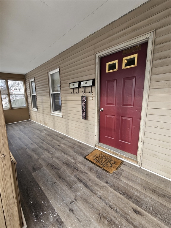 176 Corthell Street, Unit 1 Springfield, MA 01151 - Photo 21 of 28 a view of a livingroom with wooden floor and window