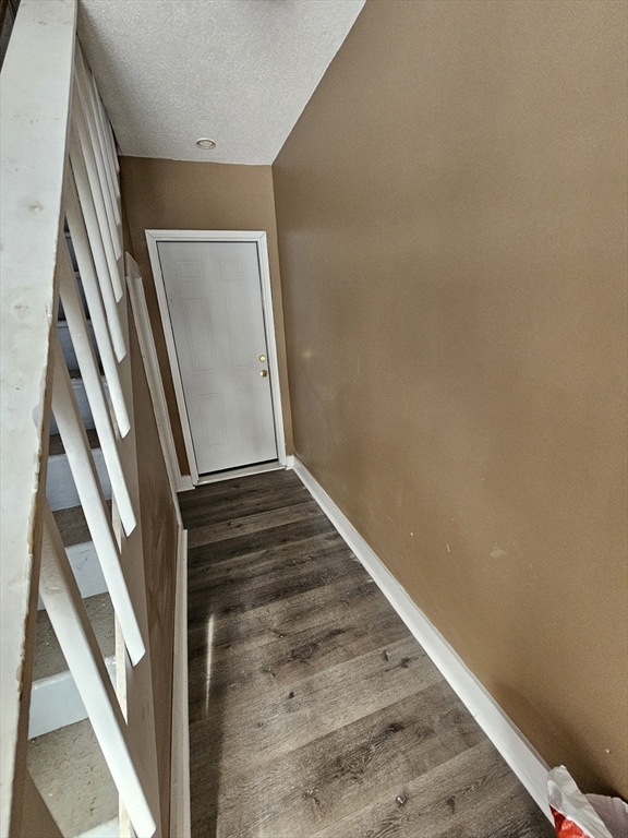 176 Corthell Street, Unit 1 Springfield, MA 01151 - Photo 22 of 28 a view of staircase with wooden floor and white door