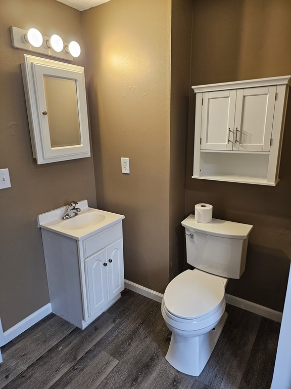 176 Corthell Street, Unit 1 Springfield, MA 01151 - Photo 10 of 28 a bathroom with a toilet sink and mirror